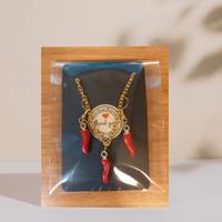 Parure orecchini e catenina con corno rosso 