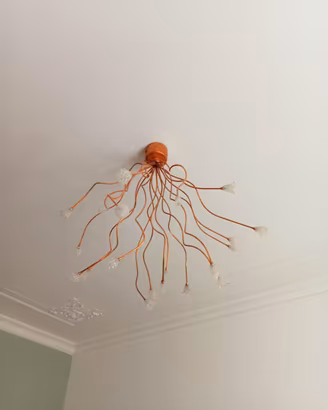 Lampadario artistico in rame con terminali