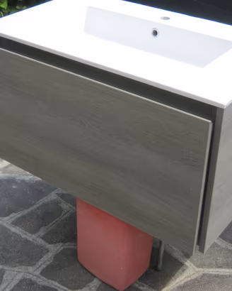 Piano lavabo in corian opaco con mobile sospeso