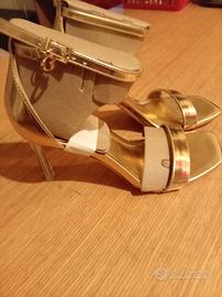 Sandali Guess originali colore oro con tacco trasp