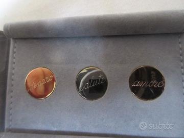 Piastre augurali in oro 18 kt.