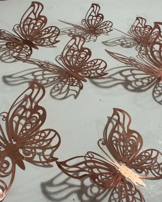 Farfalle adesive da parete 3D traforate rosa