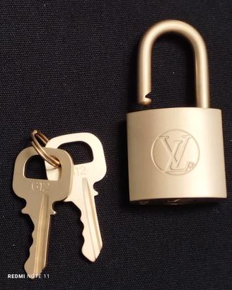 Louis Vuitton lucchetto color oro satinato 