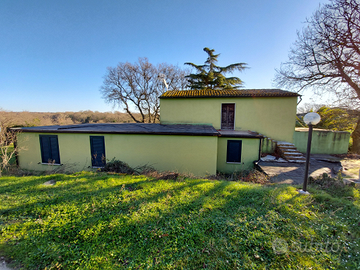 Terreno con fabbricati