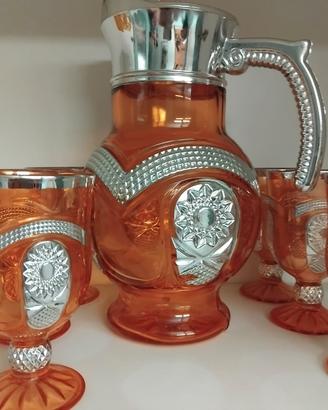 caraffa in vetro arancio e sei bicchieri
