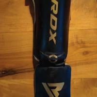 Paratibie RDX Nero e Oro – Protezione e Stile