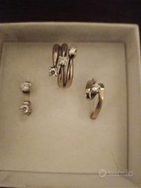 blocco orecchini, trilogi e solitario