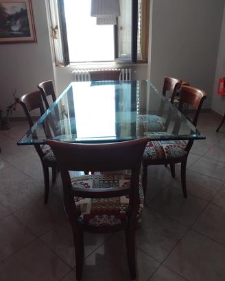 Tavolo in travertino con piano in vetro e 6 sedie