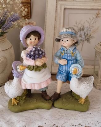 Coppia di statuine con oche - 15 cm cad.