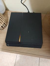 PlayStation 4  con giochi e joystick  e fili 