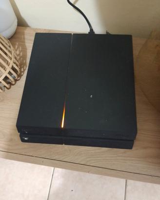 PlayStation 4  con giochi e joystick  e fili 