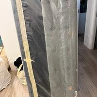 Testata letto matrimonuale in tessuto grigio