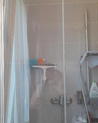 Porta in cristallo per vano doccia apert. a libro