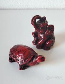 Coppia di statuette in resina