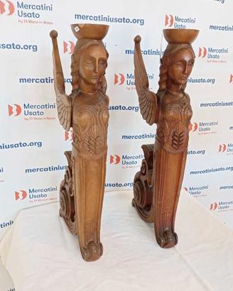 Coppia di cariatidi in legno intagliato
