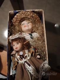 bambole in porcellana (3 pezzi)