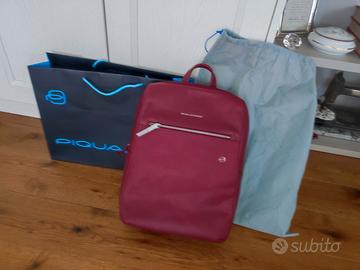 Zaino in pelle Piquadro + dustbag e busta negozio