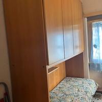 Cameretta con armadio a ponte e letto singolo