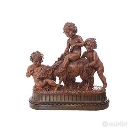 Scultura “bambini che giocano con ariete” firmato