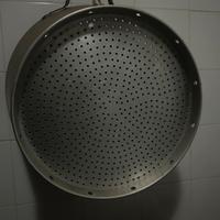 Pentola e cestello con mestolo