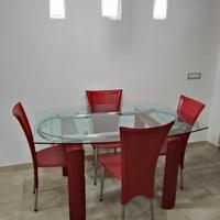 tavolo allungabile in vetro acciaio e cuoio rosso