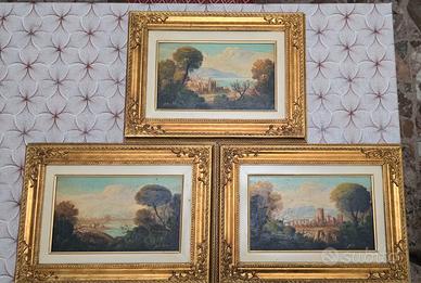 Quadri con cornice lavorata in legno dorato.