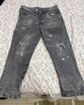 Jeans grigio  effetto spruzzato e strappato