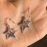 Orecchini stella pendenti Guess