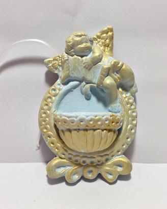 Piccola acquasantiera in terracotta  con angelo
