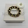 bracciale-chanel-catena-dorata-striscia-pelle-nera