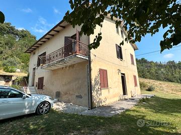 Casa con terreno agricolo e bosco