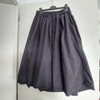 Gonna nera ampia al polpaccio