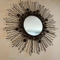 Specchio di design a forma di sole