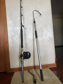 Canna da pesca con mulinello ed arpione