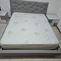 letto matrimoniale con testiera trapuntata 