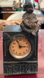 Scultura orologio Cacciabuoti