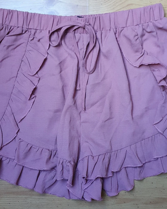 Shorts rosa con volant e fiocco in vita