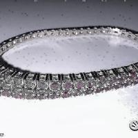 BRACCIALE TENNIS ORO 18kt. CON RUBINI NATURALI