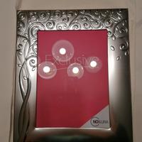 Cornice con decorazione in argento