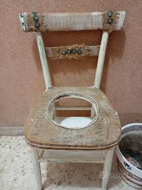 sedia con cerchio centrale con vaso di coccio 