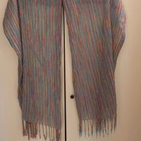 Sciarpa 35 % seta, 65 % cotone.