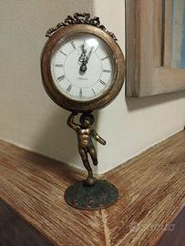  vecchia sveglia  alta 35 cm  con putto  funzionan