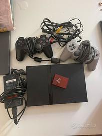 PS2 silm + 2 controller + cavi + memory card
