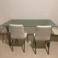 Tavolo in vetro con sedie contemporanei