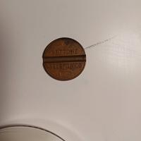 Gettone telefonico codice 7702