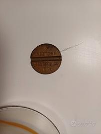 Gettone telefonico codice 7702