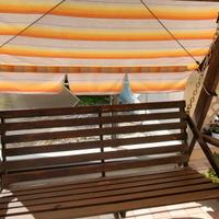 dondolo massiccio in legno