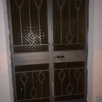 Portone esterno in ferro e vetro lavorato