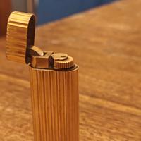 Accendino Cartier e scatola braccialetto 