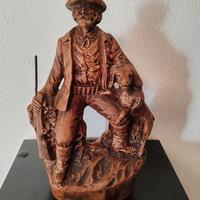 statua uomo con cane